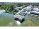 Waterfront condos feature boat lift, community pool, and lush landscaping at 2203 Starboard, Winter Haven, FL 33881