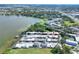 Breathtaking aerial perspective of waterfront townhomes offering serene lake views and convenient community amenities at 2203 Starboard, Winter Haven, FL 33881