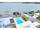 Aerial view of the property featuring community pool, waterfront access and boat house at 2203 Starboard, Winter Haven, FL 33881