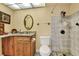 Bathroom features granite countertop, a wood cabinet, and a tiled shower at 2203 Starboard, Winter Haven, FL 33881