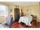 Bright bedroom featuring wood floors and a cozy floral bedspread at 2203 Starboard, Winter Haven, FL 33881