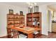 Inviting dining room features wooden furniture and shelving with unique decorative items adding a personal touch at 2203 Starboard, Winter Haven, FL 33881