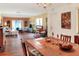 Spacious living and dining area with hardwood floors, large windows, and ample natural light throughout at 2203 Starboard, Winter Haven, FL 33881