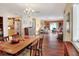 Spacious living and dining area with hardwood floors, large windows, and ample natural light throughout at 2203 Starboard, Winter Haven, FL 33881