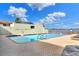 Community pool featuring clear water, lounge chairs, and secure gate for resident enjoyment and relaxation at 2203 Starboard, Winter Haven, FL 33881