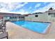 Community pool featuring lounge chairs and a covered lounge area at 2203 Starboard, Winter Haven, FL 33881