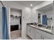 Bathroom featuring double sink vanity with granite countertop, and walk-in closet at 2244 Teneroc Trl, Lakeland, FL 33801