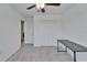 Carpeted bedroom featuring ceiling fan and closet at 2244 Teneroc Trl, Lakeland, FL 33801