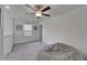 Upstairs bonus room area with ceiling fan and plush carpeting at 2244 Teneroc Trl, Lakeland, FL 33801