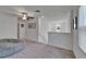 Upstairs bonus room area with ceiling fan and plush carpeting at 2244 Teneroc Trl, Lakeland, FL 33801