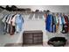 Walk-in closet with clothes hanging, and small dresser at 2244 Teneroc Trl, Lakeland, FL 33801