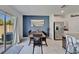 Dining room with a wooden table, modern decor, and sliding glass doors to the backyard at 2244 Teneroc Trl, Lakeland, FL 33801