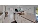 Modern kitchen features granite countertops, stainless steel appliances and white cabinets at 2244 Teneroc Trl, Lakeland, FL 33801