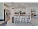 Kitchen with large island, stainless steel appliances, and modern white cabinetry at 2244 Teneroc Trl, Lakeland, FL 33801