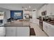 Modern kitchen features granite countertops, stainless steel appliances and white cabinets at 2244 Teneroc Trl, Lakeland, FL 33801