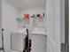 Laundry room with washer and dryer and shelf at 2244 Teneroc Trl, Lakeland, FL 33801