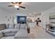 Open-concept living room seamlessly connects to the kitchen and dining area at 2244 Teneroc Trl, Lakeland, FL 33801