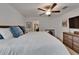 Inviting bedroom features a ceiling fan, neutral paint and natural light at 2244 Teneroc Trl, Lakeland, FL 33801