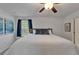 Inviting bedroom features a ceiling fan, neutral paint and natural light at 2244 Teneroc Trl, Lakeland, FL 33801
