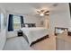 Inviting bedroom features a ceiling fan, neutral paint and natural light at 2244 Teneroc Trl, Lakeland, FL 33801