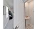 A half bathroom with a pedestal sink at 2244 Teneroc Trl, Lakeland, FL 33801
