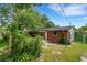 Brick exterior, lush backyard, stone walkway and privacy fencing at 2632 Handley Blvd, Lakeland, FL 33803