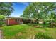 Expansive lush green backyard with brick home, mature trees and privacy fence at 2632 Handley Blvd, Lakeland, FL 33803