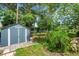 Backyard with shed and lush landscaping at 2632 Handley Blvd, Lakeland, FL 33803