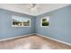 Calming bedroom featuring tile flooring, natural light from two windows, and fresh paint at 2632 Handley Blvd, Lakeland, FL 33803