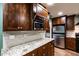 Elegant kitchen with granite counters, custom cabinetry, and stainless steel appliances at 2632 Handley Blvd, Lakeland, FL 33803