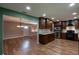 Updated kitchen with dark cabinets, stainless steel appliances, and granite countertops at 2632 Handley Blvd, Lakeland, FL 33803