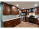 Beautiful kitchen with custom wood cabinets, stainless steel appliances, and tile backsplash at 2632 Handley Blvd, Lakeland, FL 33803