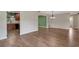 Open concept living area featuring hardwood floors, neutral walls, and seamless transition to the kitchen at 2632 Handley Blvd, Lakeland, FL 33803