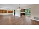 Open floor plan featuring hardwood floors and a view of the updated kitchen with modern appliances and fixtures at 2632 Handley Blvd, Lakeland, FL 33803