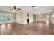 Spacious living area with hardwood floors, featuring an open layout with access to the backyard through glass doors at 2632 Handley Blvd, Lakeland, FL 33803