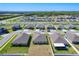 Aerial view showcasing a residential area with well-maintained lawns, modern homes, and landscaping at 2929 Flying Blackbird Rd, Bartow, FL 33830