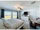 Bright bedroom with lots of natural light, large window, and mounted television at 2929 Flying Blackbird Rd, Bartow, FL 33830
