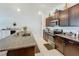 Kitchen features stainless appliances, dark cabinets, and granite countertops at 2929 Flying Blackbird Rd, Bartow, FL 33830