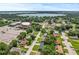 Aerial view of the neighborhood, highlighting the home's proximity to a lake and community amenities at 3016 Reiter Dr, Auburndale, FL 33823