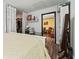 Bedroom featuring neutral decor, wood floors, and adjoining room view at 3016 Reiter Dr, Auburndale, FL 33823