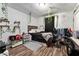 Cozy bedroom with wood-look flooring, natural light, and charming decor at 3016 Reiter Dr, Auburndale, FL 33823