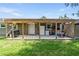 Inviting covered patio with outdoor kitchen area and access to storage at 3016 Reiter Dr, Auburndale, FL 33823