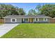 Well-maintained home with green lawn, painted brick and updated windows at 3016 Reiter Dr, Auburndale, FL 33823
