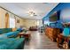 Spacious living room with open floor plan and eye-catching blue accent wall at 3016 Reiter Dr, Auburndale, FL 33823