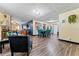 Open-concept living area with laminate floors and colorful decor throughout at 3016 Reiter Dr, Auburndale, FL 33823