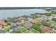 Aerial view showcasing houses located on the lake at 3121 Highlands By The Lake Way, Lakeland, FL 33812