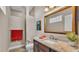 Bathroom featuring wood vanity with granite counters and a walk-in shower at 3121 Highlands By The Lake Way, Lakeland, FL 33812