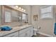 Well-lit bathroom featuring granite countertops, a white vanity, and tile floors at 3121 Highlands By The Lake Way, Lakeland, FL 33812