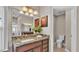 Bathroom showcasing a granite countertop, wood cabinets, and separate toilet room at 3121 Highlands By The Lake Way, Lakeland, FL 33812