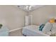 Simple bedroom with a double bed, ceiling fan, and neutral walls at 3121 Highlands By The Lake Way, Lakeland, FL 33812